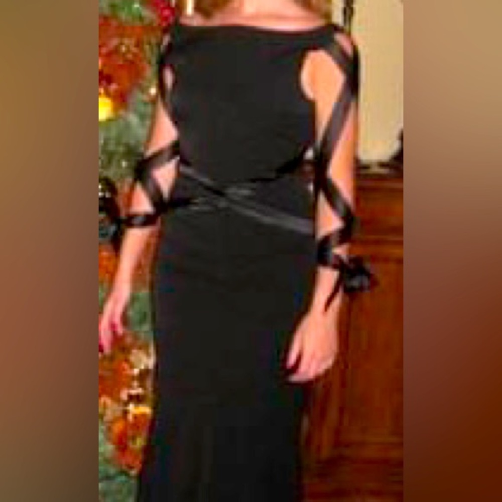 Floor length black gown.